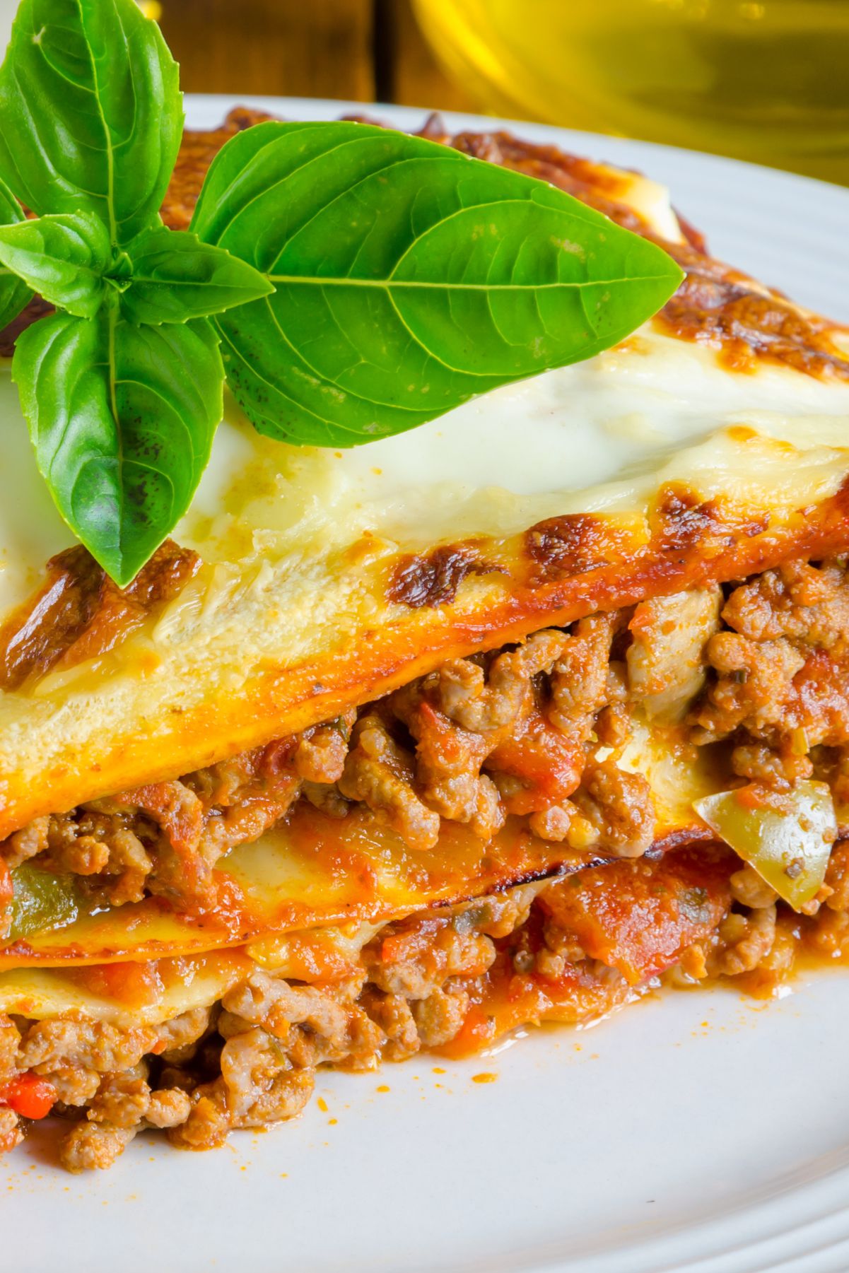 Closeup of Weight Watchers Lasagna with Meat Sauce on a white plate.