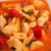 Closeup of Weight Watchers Slow Cooker Sweet & Sour Chicken in a white bowl.