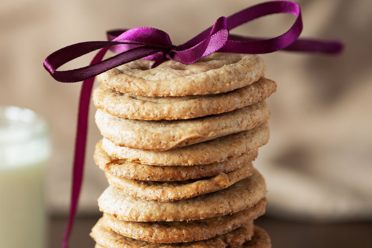 A stack of Weight Watchers Caramel Cookies with a purple bow on top.