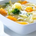 Vegetable soup in a square, white bowl