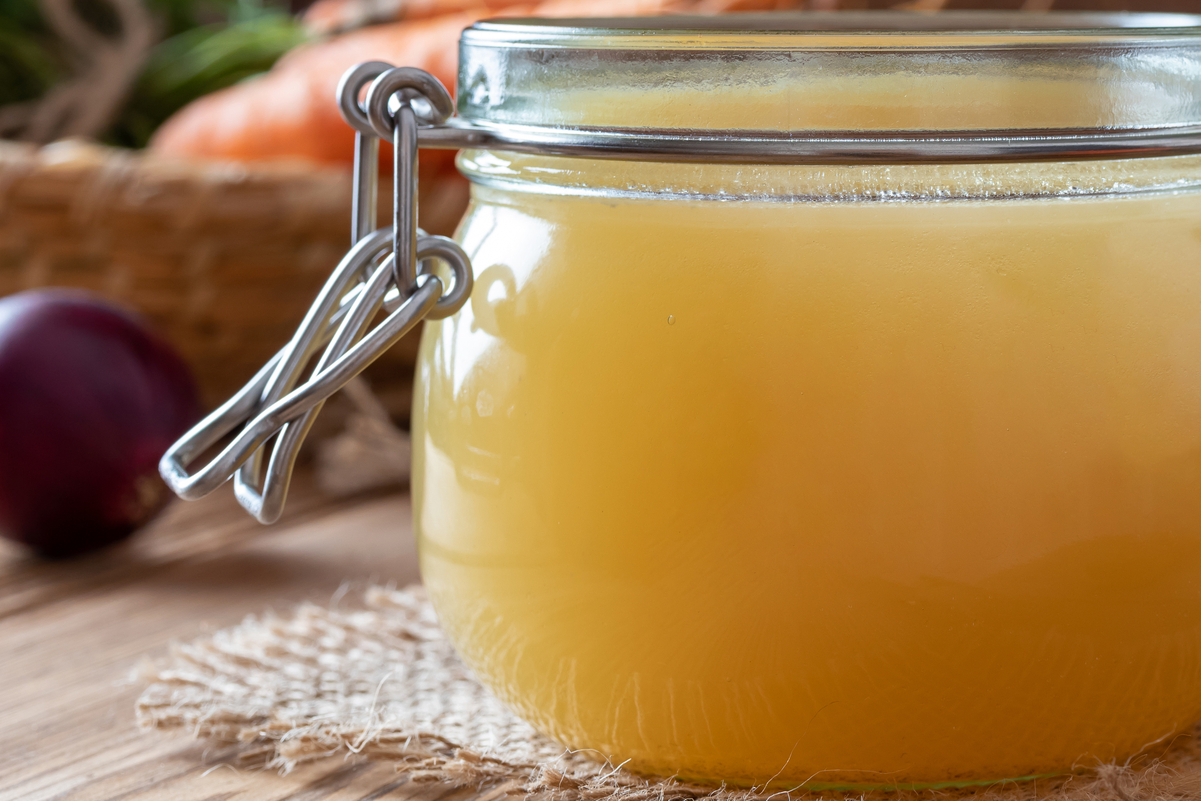 Chicken broth in a glass jar with a lid.