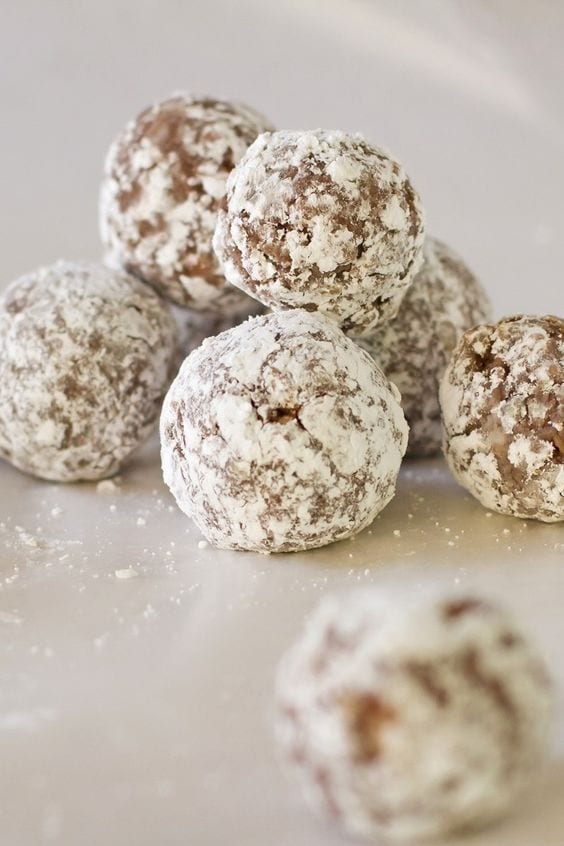 Weight Watchers Chocolate Rum Balls in a pile on a white plate.