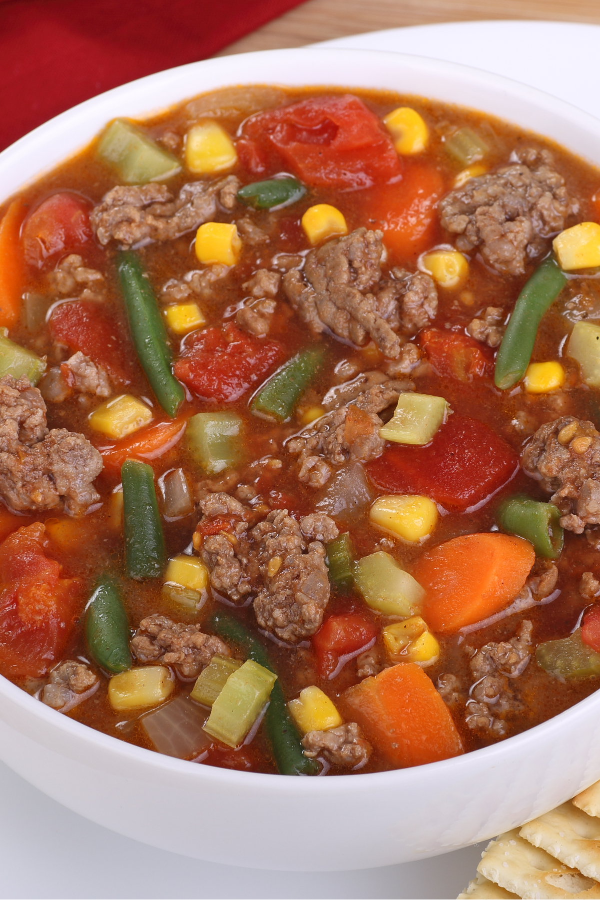 Closeup of Weight Watchers Hamburger Vegetable Soup in a white bowl.