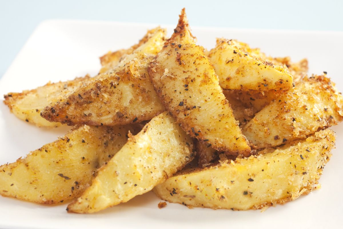 a pile of Baked Cumin Fries on a white plate.