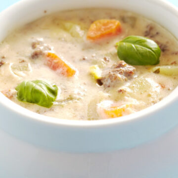Closeup of Weight Watchers Cheeseburger Soup in a white crock.