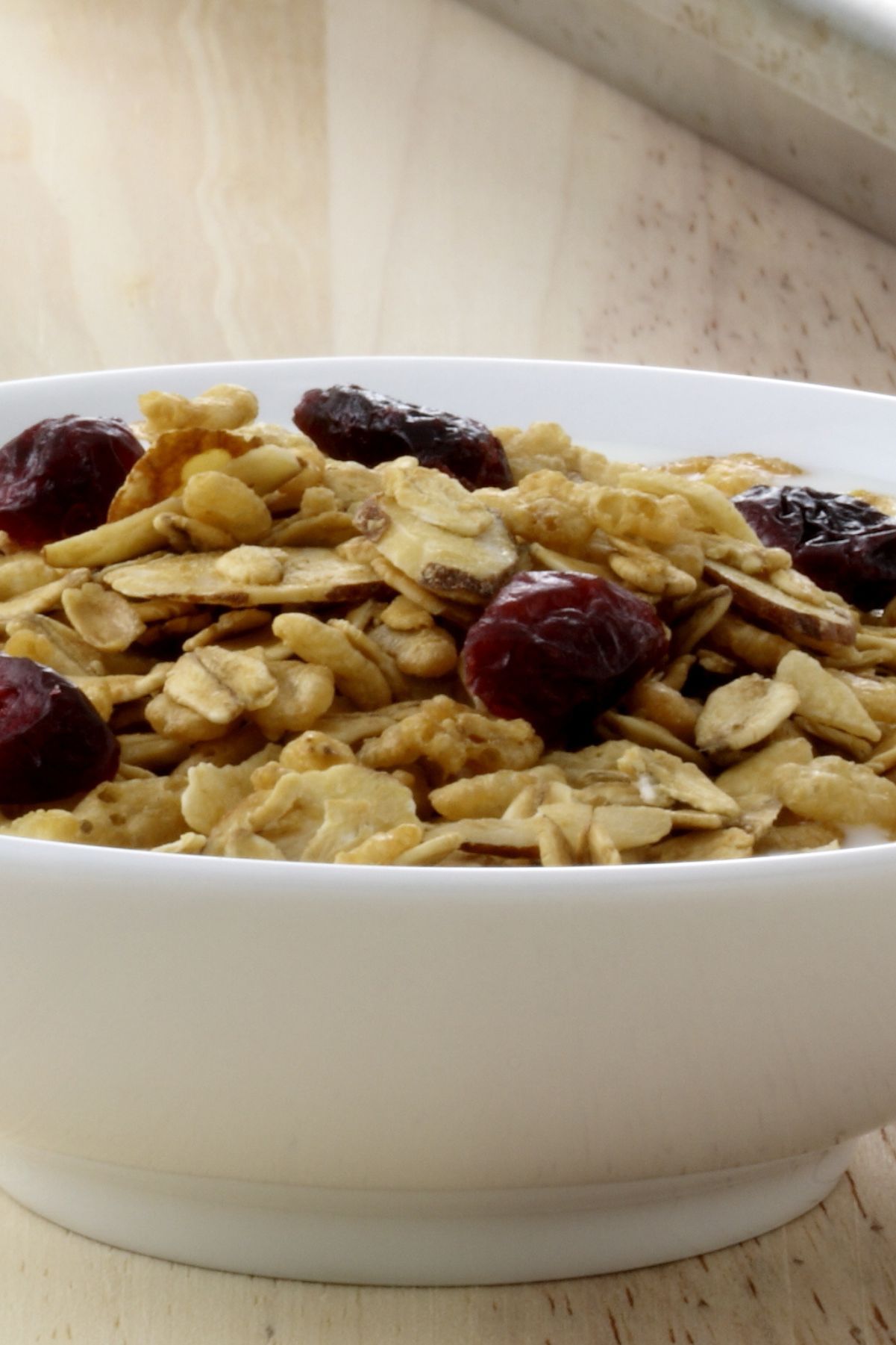 Closeup of Weight Watchers Homemade Granola in a white bowl.