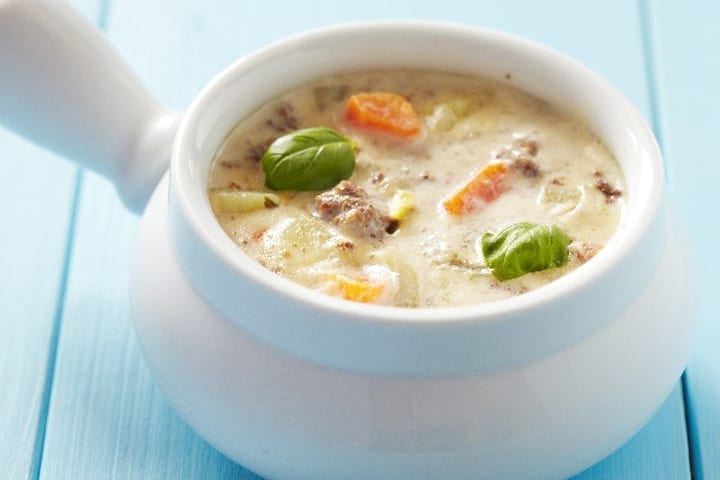 Weight Watchers Cheeseburger Soup in a white crock.