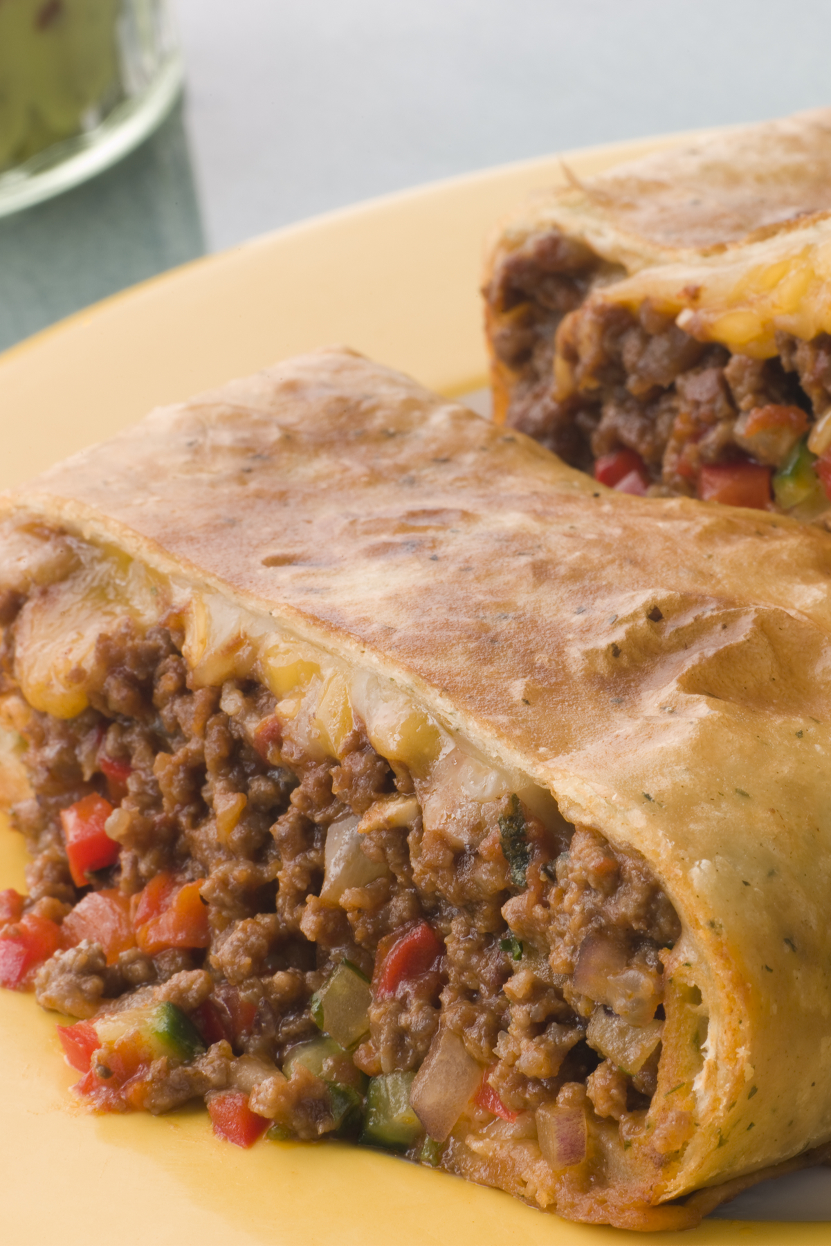 Closeup of Weight Watchers Mexican Chimichangas on a yellow plate.