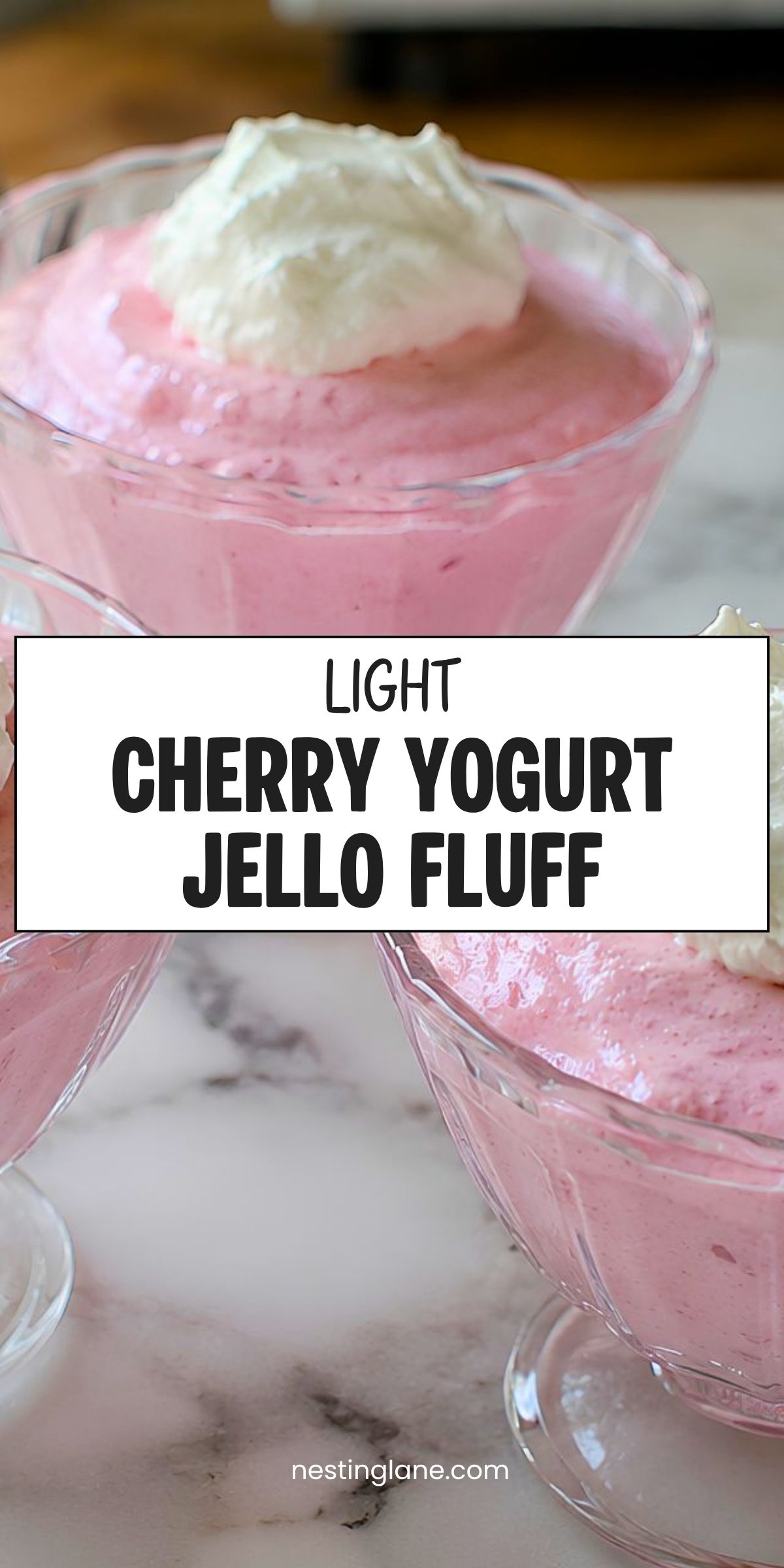 Pink cherry yogurt Jello fluff in glass dessert cups with whipped topping, overlaid with the text “Light Cherry Yogurt Jello Fluff” and “nestinglane.com.”