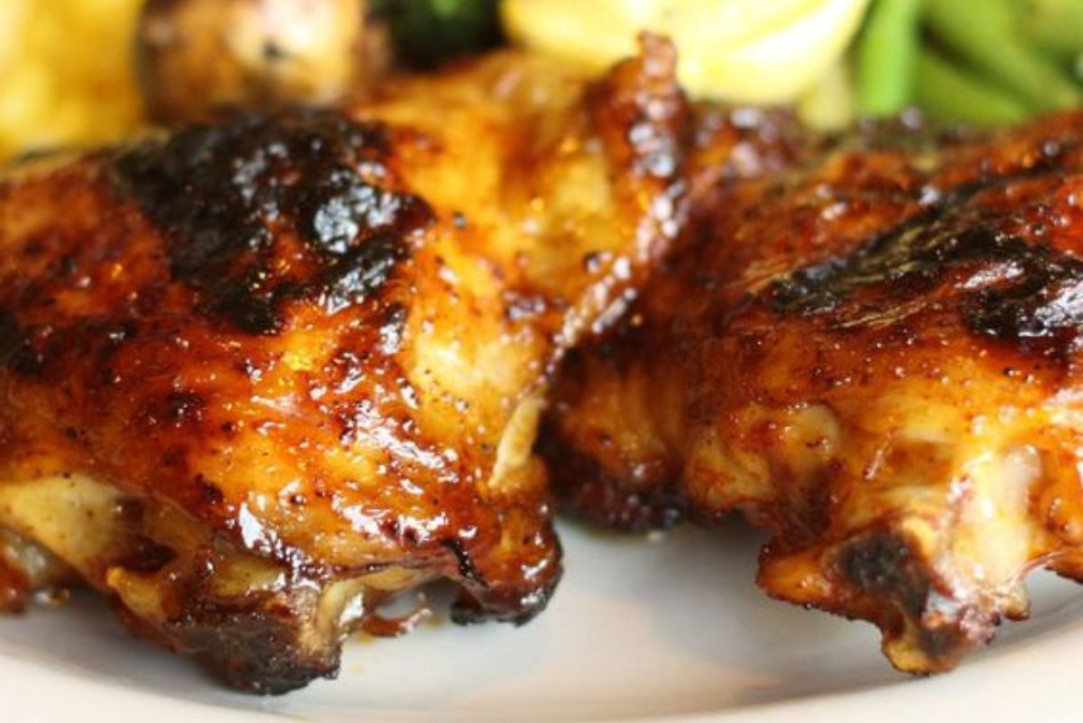 Closeup of Weight Watchers Key West Chicken on a white plate with vegetables.