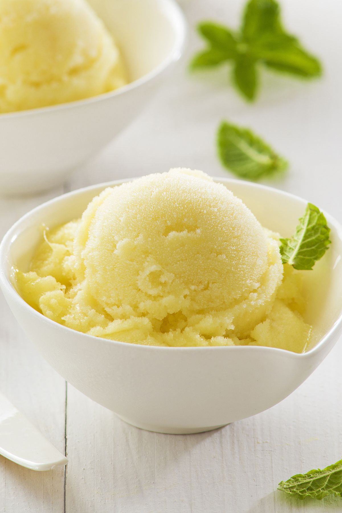 Weight Watchers Lemon Sorbet in a white bowl on a white surface.