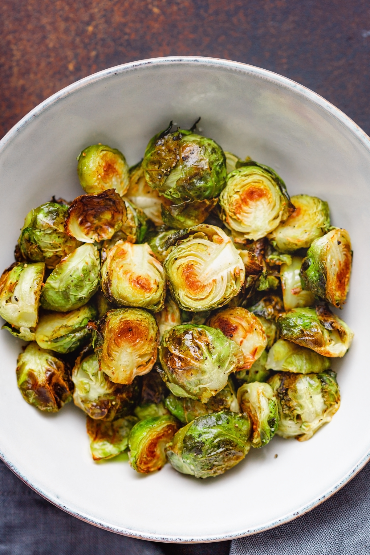 Closeup of Simple Weight Watchers Instant Pot® Brussels Sprouts on a white dish.
