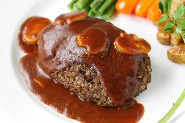 Weight Watchers Skillet Salisbury Steak on a white plate with vegetables.