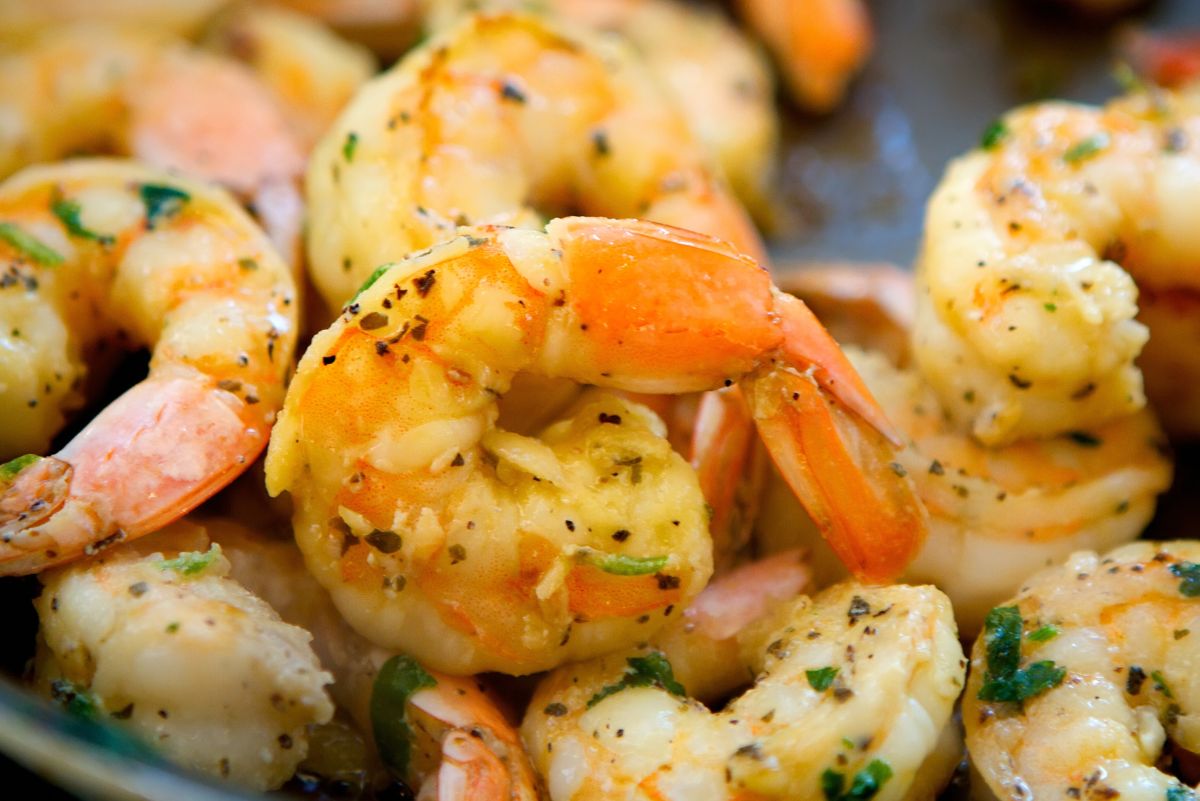 Weight Watchers Grilled Garlic Herb Shrimp on a dark plate.