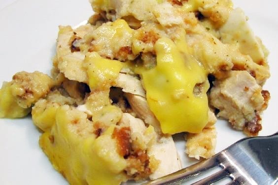 Weight Watchers slow cooker chicken and stuffing on a white plate with a fork.