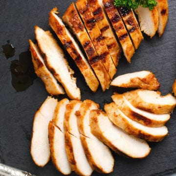 Weight Watchers Grilled Honey Dijon Chicken Recipe on a black cutting board.