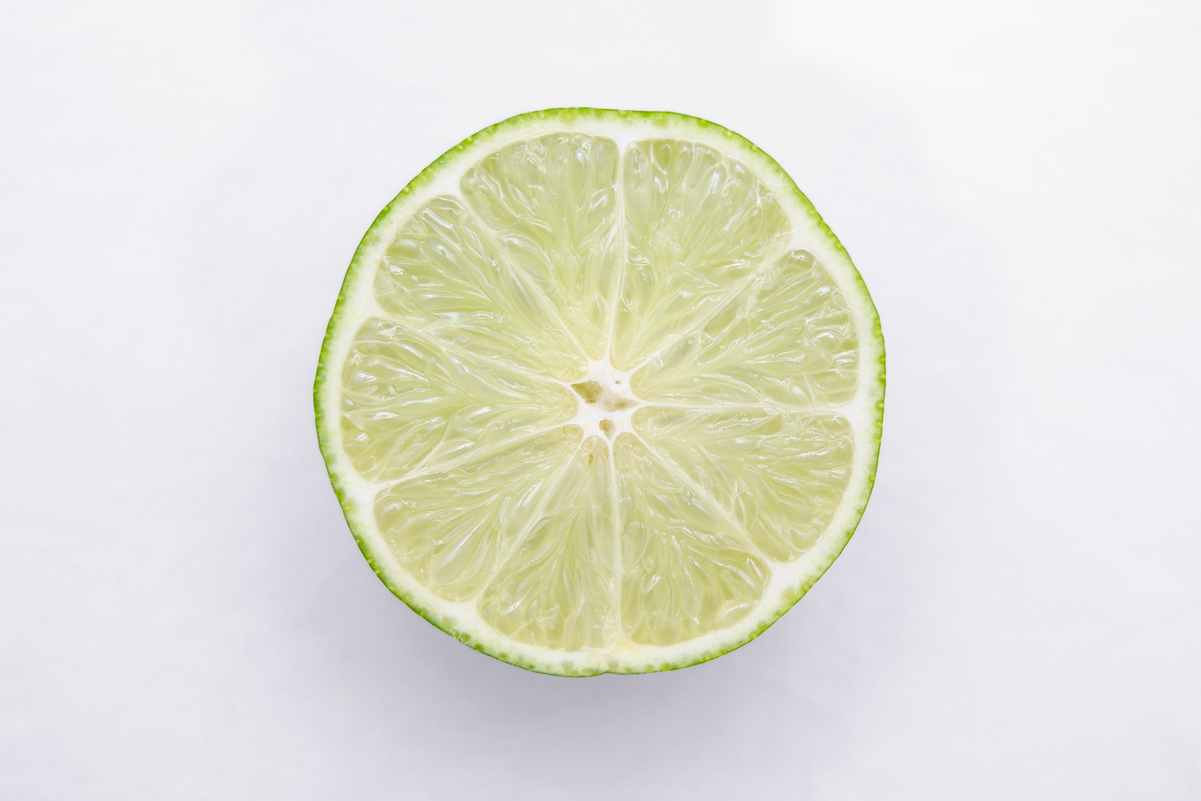 A half of a lime on a white background.