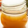 Instant Pot Weight Watchers Chicken Broth in a clear glass canning jar.