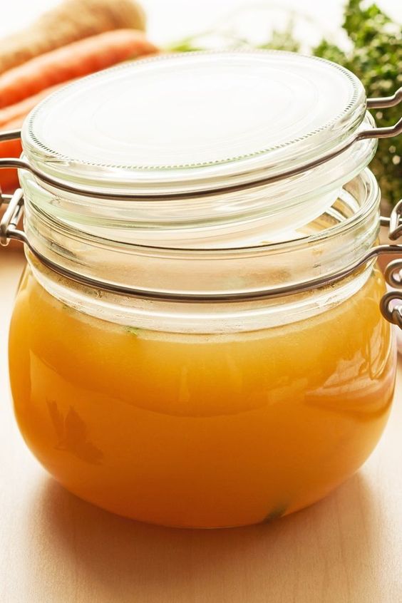 Instant Pot Weight Watchers Chicken Broth in a clear glass canning jar.