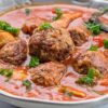 Closeup of Weight Watchers Mexican Meatball Soup in a white bowl.