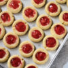 Raspberry Thumbprint Cookies on a baking sheet.