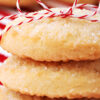 Closeup of Traditional Sugar Cookies wrapped in a red and white stripped string.