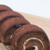 Weight Watchers Swiss Rolls with Cherry and Cream Cheese Filling on a cutting board.