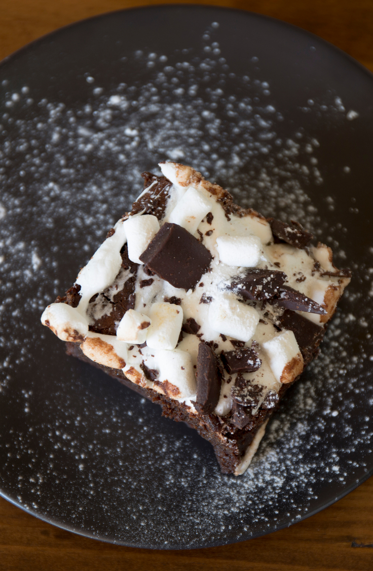 Close up of Weight Watchers Chocolate Rocky Road Bars on a black plate