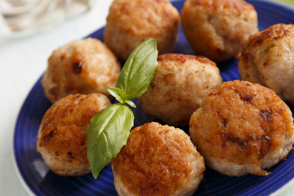 Closeup of Weight Watchers Quick Air-Fryer Turkey Meatballs on a blue plate with a white background.