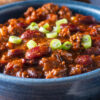 Closeup of Weight Watchers Sirloin Beef and Bean Chili in a blue bowl.
