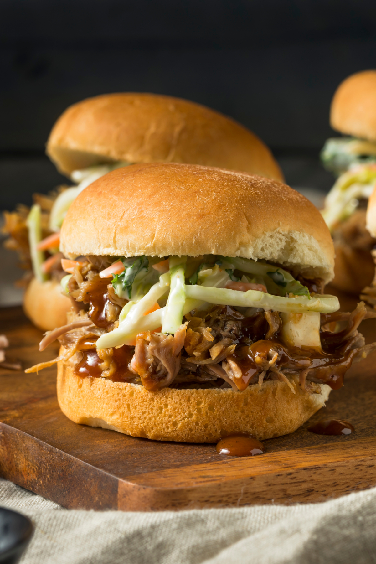 Closeup of Chicken Slider on a wooden cutting board.