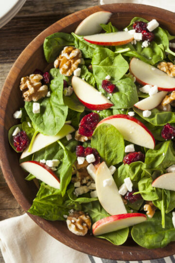 Closeup of Weight Watchers Fall Salad with Cider Dressing in a wooden salad bowl.