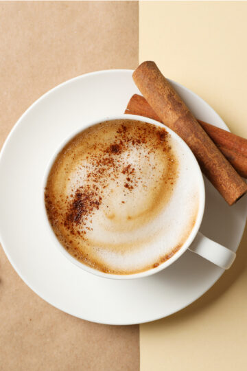 Weight Watchers Cinnamon Cappuccino in a white coffee cup with cinnamon sticks
