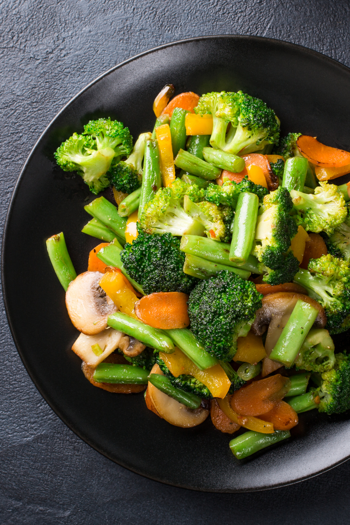 Closeup of Weight Watchers Healthy Vegetable Stir-Fry in a black bowl.