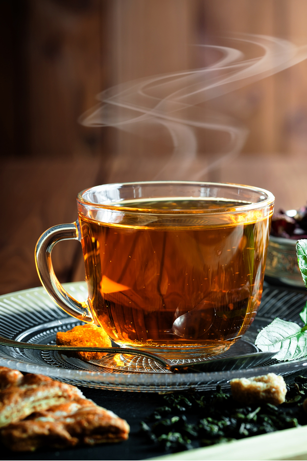 Weight Watchers Mint Darjeeling Tea in a clear glass cup with steam coming out the top.
