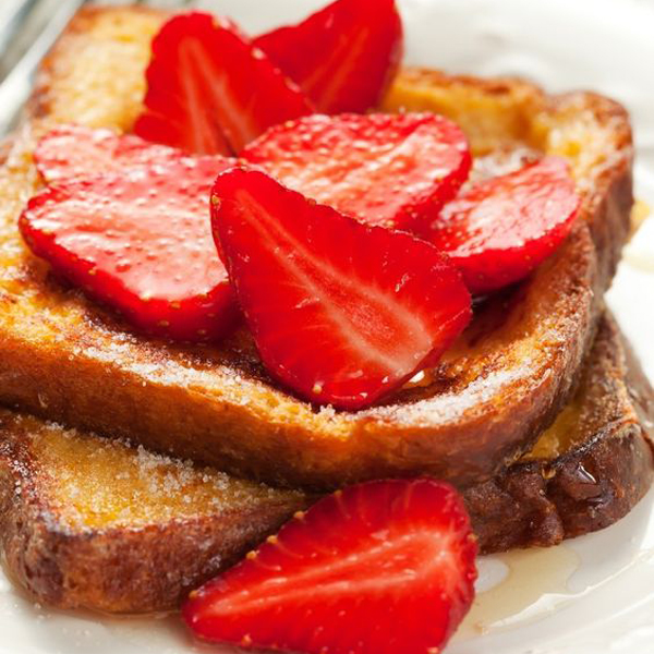 French Toast topped with sliced strawberries