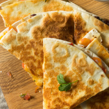 Weight Watchers Vegetable Quesadilla on a wooden cutting board.