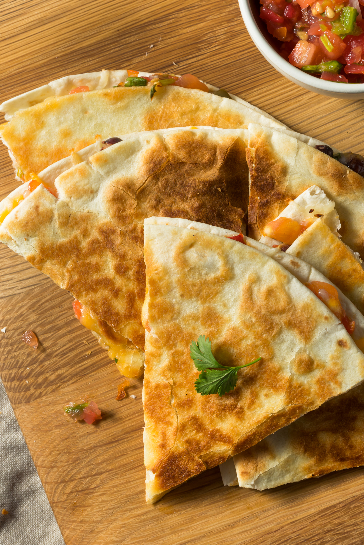 Weight Watchers Vegetable Quesadilla on a wooden cutting board.