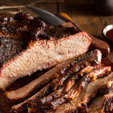 WW Instant Pot Beef Beer Brisket on a wooden cutting board.