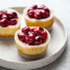 Weight Watchers Mini Cheesecakes with Cherry and Chocolate on a white tray.
