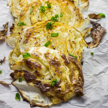 Roasted Cabbage Wedges on a cutting board.