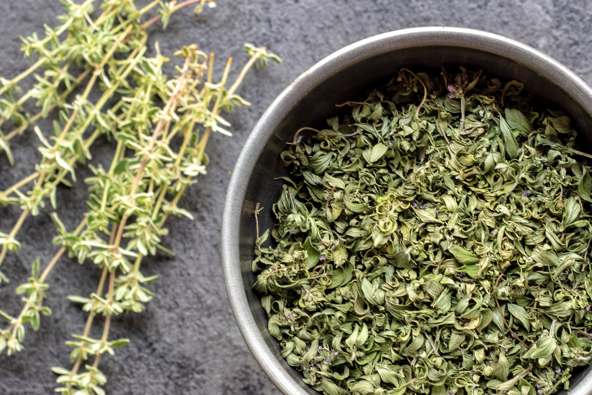 Dried Thyme in a white bowl.