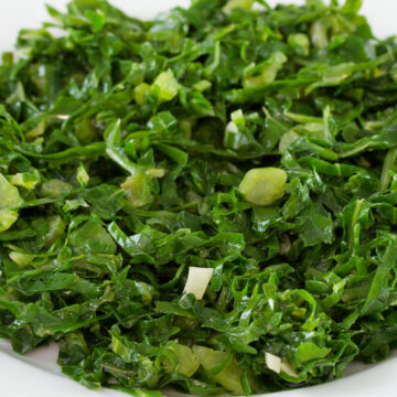 Closeup of Weight Watchers Lemon Garlic Kale in a white dish.