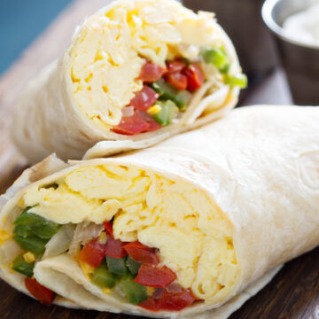 Weight Watchers Spicy Mexican Breakfast Burritos on a wooden cutting board.