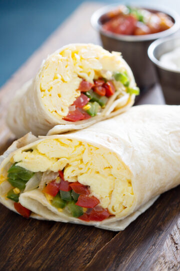 Weight Watchers Spicy Mexican Breakfast Burritos on a wooden cutting board.