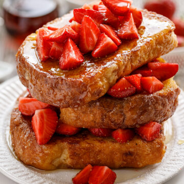 A stack of Best Grilled French Toast on a white plate.
