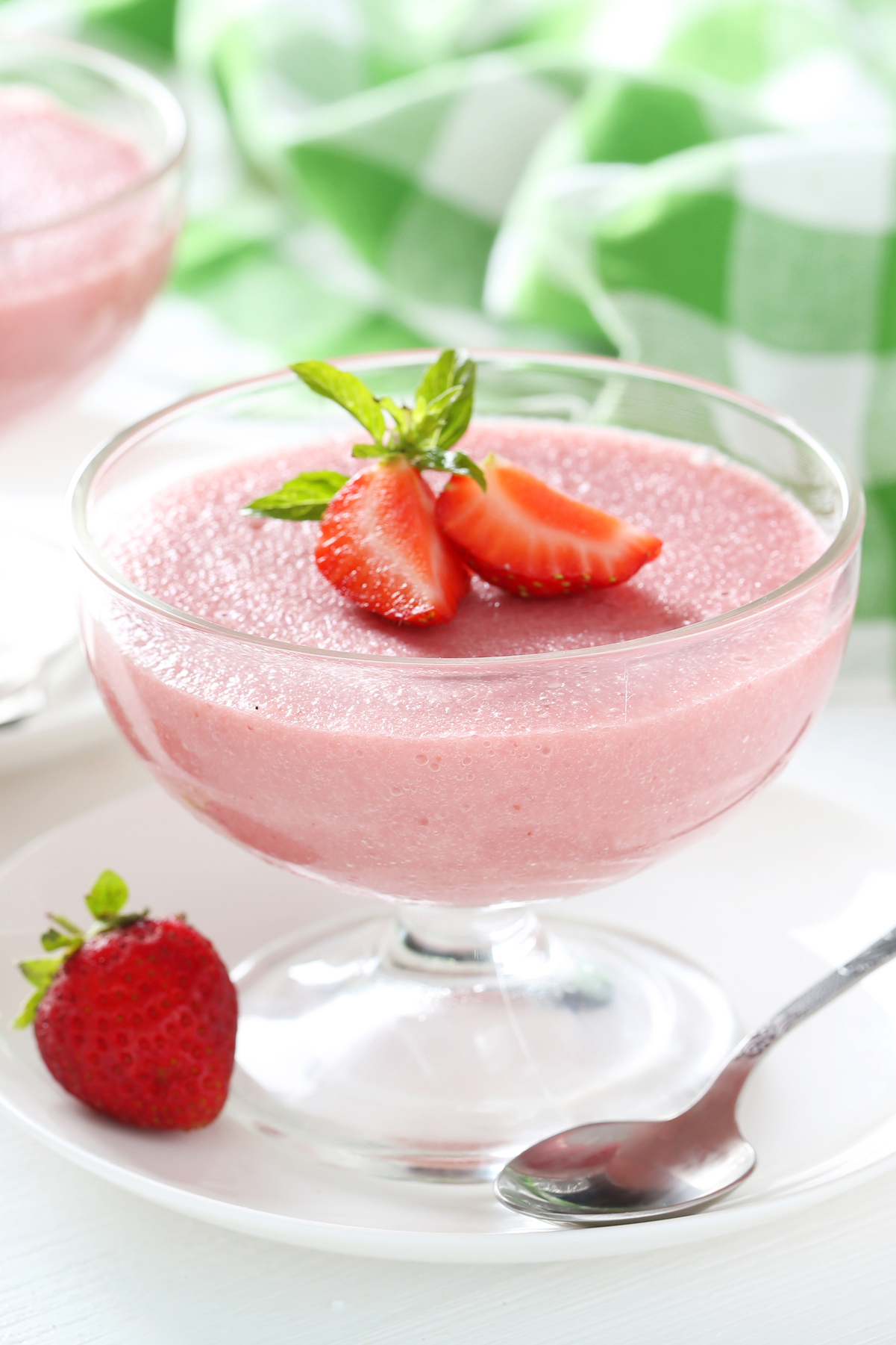 Simple Strawberry Cream Cheese Mousse (Weight Watchers) Recipe in a clear glass footed dish with fresh strawberries on top and around it.