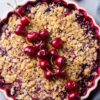 Weight Watchers Cherry and Rhubarb Crumble Dessert in a white pie plate.