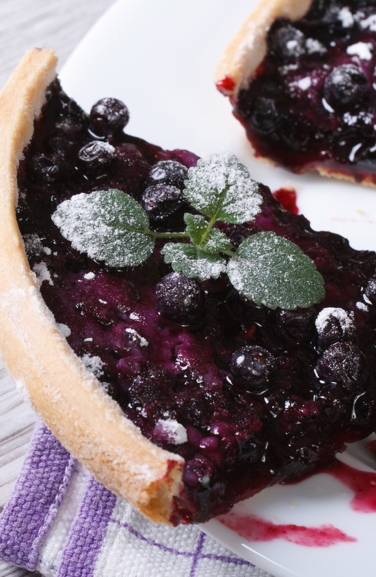 a slice of Simple Weight Watchers Blueberry Pie on a white plate.