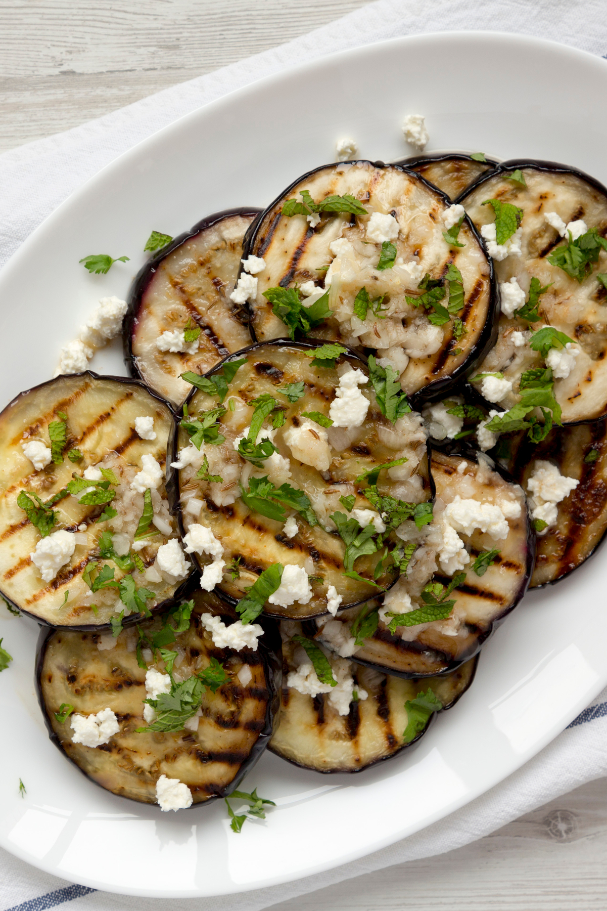 Closeup of Weight Watchers Grilled Greek Eggplant on a white plate.